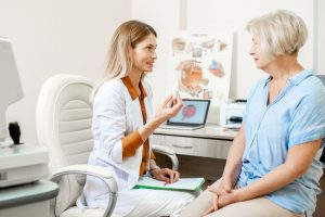 doctor consulting with senior patient